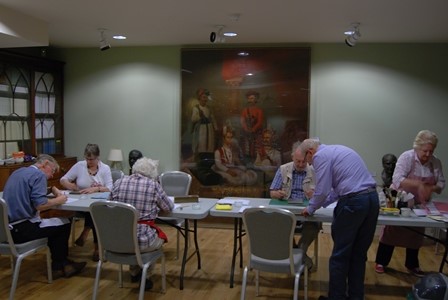 NADFAS group undertaking repair work on the Society’s collections in 2014.
